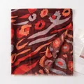 Elegant thin women's silk scarf with ethnic leopard print in burgundy and orange colors - Brown Red