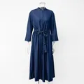Close-up detail of navy blue denim maxi dress with stand collar and drawstring waist. - M / Dresses / Dark Blue