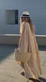 Elegant beige long flowy cardigan dress shown in natural sunlight with straw bag - Dresses / Khaki