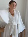 Elegant white wrap cardigan dress featuring flowing wide sleeves and crinkled fabric texture. - Dresses / White