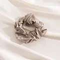 Elegant champagne beige large silk scrunchie featuring premium pleated satin texture - Apricot Gray
