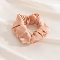 Elegant large champagne silk scrunchie with soft satin texture on white fabric background - L / Champagne Pink