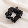 Elegant black large silk scrunchie with satin finish on white fabric background - L / Black