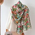 Elegant mulberry silk scarf with vibrant floral print draped over a cream blazer - 176*110cm / Spring Small Flowers (FHZ25-9719-1)