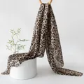 Elegant mulberry silk leopard print scarf displayed on a minimalist white stage. - 176*110cm / Grey Brown Leopard
