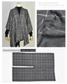 Detailed view of gray checkered split shawl poncho with fabric texture and size info - Striped Checkered Dark Gray