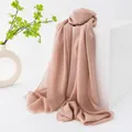 Elegant dusty rose wool scarf draped on a white display block for a soft look - Nude
