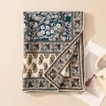 Detail of luxury silk wool shawl with intricate paisley and floral double-sided prints - Double-Sided Lily of the Valley