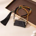 Close-up of handmade Xiangyunsha silk lipstick bag with beaded strap and tassel - Retro Lipstick Bag Charm (FHS25-3002-1)