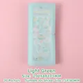 Classeur d'autocollants translucide vert clair avec 30 pochettes et fermeture élastique - Vert Pâle