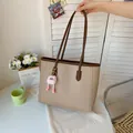Fashionable khaki large capacity tote bag with brown handles and pink monster charm - With Pendant / Khaki