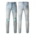Light blue distressed slim fit jeans with teal ribbed knee patches detail view - EU 28 / Light Blue