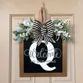 Personalized wooden front door hanger featuring letter Q with striped bow and floral decor - Letter Q