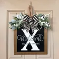 Custom wooden front door welcome sign featuring letter X with floral and bow decor - Letter X