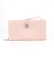 Detail view of stylish pink women's clutch wallet with rhinestone buckle and wristlet strap - Pink