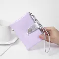 Stylish lavender cracked leather wristlet wallet with silver strap and pearl charm detail - Purple