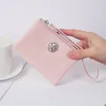 Elegant pink short wallet featuring a sparkling rhinestone embellishment and wrist strap. - Pink