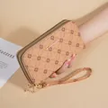 Elegant beige floral patterned long wallet with double zippers and wrist strap - Orange