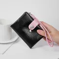 Small black crinkled leather wristlet wallet with pearl detail and pink strap - Black