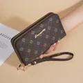 Elegant dark brown soft leather long wallet for women featuring floral pattern and double zippers - Coffee