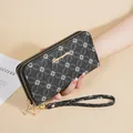 Elegant black long wallet for women with floral pattern and double zippers with strap - Black