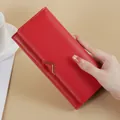 Elegant red long PU leather wallet for women with a decorative golden V-clasp detail. - Red