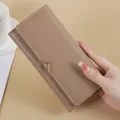 Elegant taupe long PU leather wallet for women with V-shaped gold metal accent - Khaki