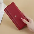 Elegant red long quilted leather wallet for women with gold circular metal clasp. - Red