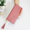 Elegant pink long wallet for women featuring heart-shaped tassel and flap closure - Watermelon red