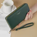 Elegant dark green long women's wallet with wrist strap and textured finish clutch - Green
