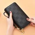 Premium black embossed long wallet for women featuring double zipper and wrist strap - Black