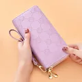 Elegant purple embossed long wallet for women with double zipper and detachable wristlet - Purple