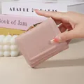 Small dusty pink wallet for women featuring a cute embossed bunny logo and gold clasp - Pink
