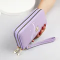 Elegant lavender double zipper long wallet with wristlet and pearl crown detail. - Purple