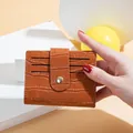 Portable brown crocodile pattern small wallet with snap button and multiple card slots - Brown