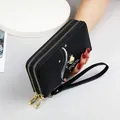 Elegant women's black double-zipper long wallet with pearl detail and wrist strap - Black