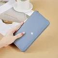 Elegant light blue pebble grain leather long wallet for women featuring gold zipper closure - Blue