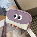 Simpatico portamonete in pelle viola con design a occhi e tripla chiusura a zip da polso - Viola