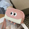 Portamonete carino in pelle rosa e crema con cinturino da polso e occhi buffi - Rosa