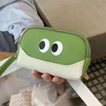 Portamonete in pelle verde con occhi cartoon, cinturino da polso e design colorato - Verde mela