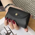 Premium black genuine leather mini coin purse with textured finish and gold snap - Black