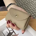 Premium Japanese style genuine leather mini coin purse in khaki color held in hand - Gray