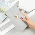 Minimalist grey crossbody mobile phone bag with gold metal lock clasp for women. - Light Gray