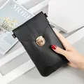 Stylish black crossbody phone bag with gold clasp and touch screen window feature - Black