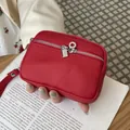Red mini portable coin purse with double zipper and pebbled leather texture - Red