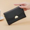 Elegant black pebbled leather women's mid-size wallet with gold-tone hardware - Black