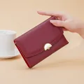 Elegant wine red textured leather medium wallet with stylish gold hardware clasp for women - Red