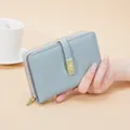 Women's light blue PU leather wallet with gold buckle and zip closure - Blue