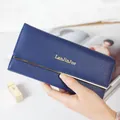 Elegant navy blue women's long wallet with gold metal trim and stylish brand logo. - Dark Blue