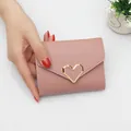 Stylish pink mini folding wallet for women featuring an elegant gold heart-shaped buckle. - Heart Style / Light Pink